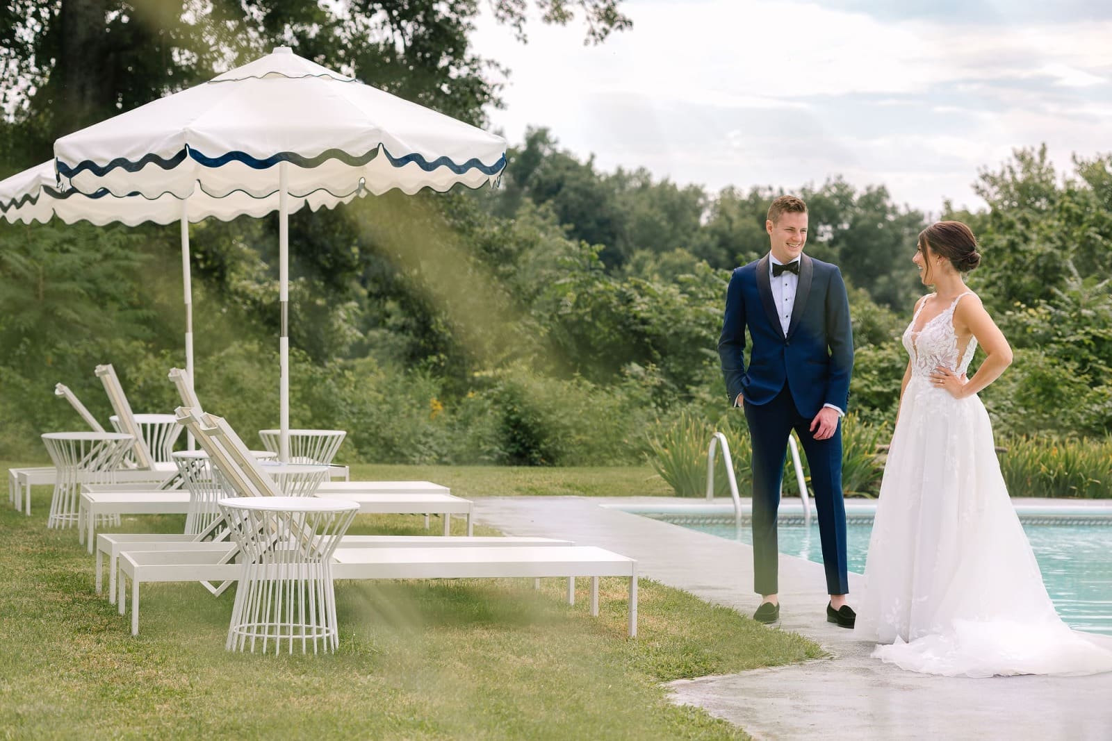 Stone Ridge NY wedding at Farmhouse couple standing by the pool
